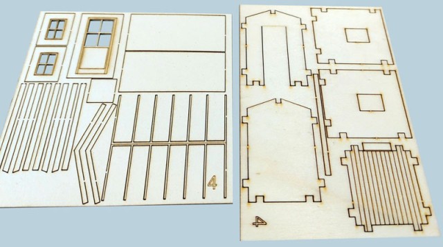 Amenées par Pierre, trois guérites Nord en bois, brique et béton déjà décrites sur le forum. Réalisées par « CBAK » sur demande, ce sont encore des prototypes. Leur aménagement va demander une petite description ! Ci-dessus des vues de quelques planches découpées au laser dela version corrigée/améliorée.<br /><br />Simplicité du kit à la portée de tout amateur. Les épaisseurs diffèrent selon l'utilité des pièces. L’avantage du kit, c’est qu’il peut être envoyé facilement en lettre dans une enveloppe matelassée !